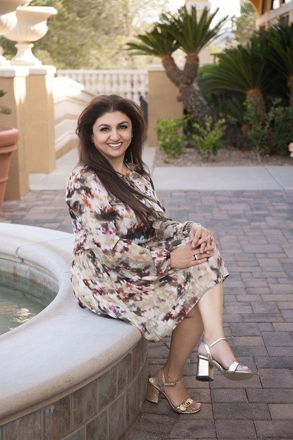 Pariz, founder of Pariz Salon, poolside portrait